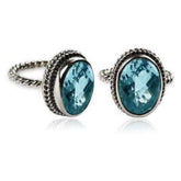 Handcrafted Bali silver ring with oval Blue Topaz Quartz and rope-style band.